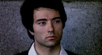 Movie still from “Teorema” (1968), directed by Pier Paolo Pasolini – A person wearing a shirt and tie; Close Up shot, High angle