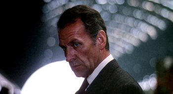Movie still from “Teorema” (1968), directed by Pier Paolo Pasolini – A man in a suit and tie; Close Up shot, Low angle