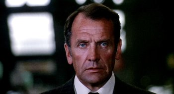 Movie still from “Teorema” (1968), directed by Pier Paolo Pasolini – An older man wearing a suit and a tie; Close Up shot, Low angle