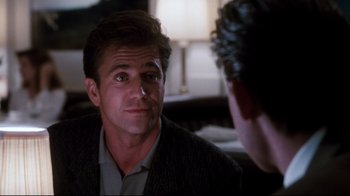 Movie still from “Tequila Sunrise” (1988), directed by Robert Towne – A person taking a picture of another person; Close Up shot, Over the shoulder angle