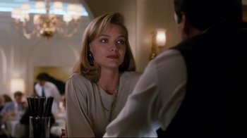 Movie still from “Tequila Sunrise” (1988), directed by Robert Towne – A woman sitting in front of a man in front of a mirror; Close Up shot, Over the shoulder angle