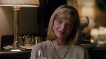 Movie still from “Tequila Sunrise” (1988), directed by Robert Towne – A person wearing a white shirt; Close Up shot, Low angle