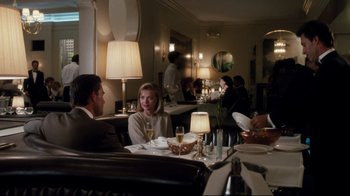 Movie still from “Tequila Sunrise” (1988), directed by Robert Towne – A group of people sitting at a table in a restaurant; Wide shot, Over the shoulder angle