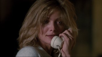 Movie still from “Tequila Sunrise” (1988), directed by Robert Towne – A person talking on a phone; Close Up shot, Low angle