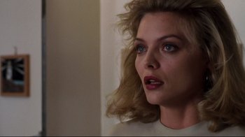 Movie still from “Tequila Sunrise” (1988), directed by Robert Towne – A person with long blonde hair; Close Up shot, Low angle