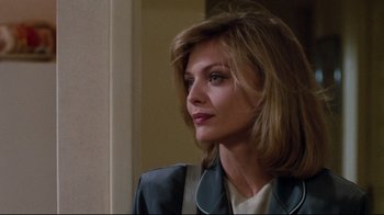 Movie still from “Tequila Sunrise” (1988), directed by Robert Towne – A person wearing a jacket; Close Up shot, Over the shoulder angle