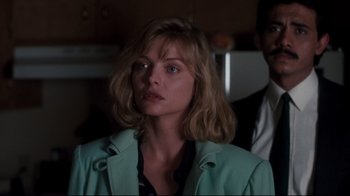 Movie still from “Tequila Sunrise” (1988), directed by Robert Towne – A person wearing a jacket; Close Up shot, Over the shoulder angle