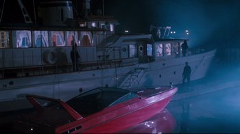 Movie still from “Tequila Sunrise” (1988), directed by Robert Towne – A boat in a body of water at night time; Extreme Wide shot, High angle