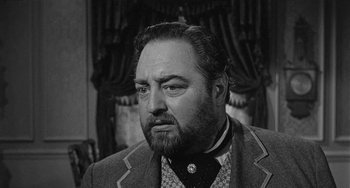 Movie still from “Terror in a Texas Town” (1958), directed by Joseph H. Lewis – An old photo of a man with a beard; Close Up shot, Low angle