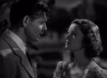 Movie still from “Test Pilot” (1938), directed by Victor Fleming – A man and a woman looking at one another; Close Up shot, Low angle