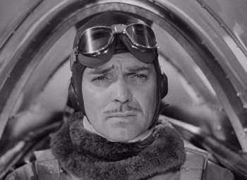 Movie still from “Test Pilot” (1938), directed by Victor Fleming – An old photo of a man in a fighter jet; Close Up shot, Low angle
