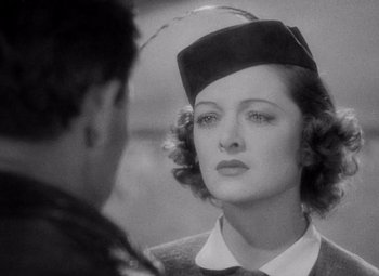 Movie still from “Test Pilot” (1938), directed by Victor Fleming – An old photo of a woman looking at a man; Close Up shot, Over the shoulder angle