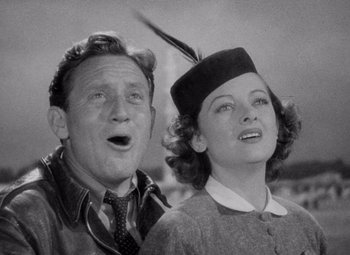 Movie still from “Test Pilot” (1938), directed by Victor Fleming – An older man and a young woman singing together; Close Up shot, Low angle