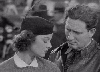 Movie still from “Test Pilot” (1938), directed by Victor Fleming – An old photo of a man and a woman looking at each other; Close Up shot, Low angle