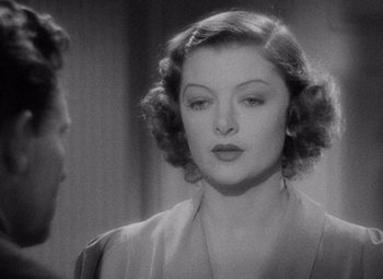 Movie still from “Test Pilot” (1938), directed by Victor Fleming – An old black and white photo of a woman; Close Up shot, Over the shoulder angle