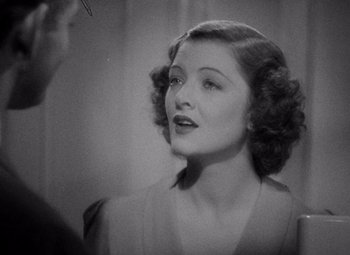 Movie still from “Test Pilot” (1938), directed by Victor Fleming – An old photo of a woman in a black and white photo; Close Up shot, High angle