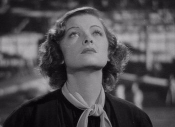 Movie still from “Test Pilot” (1938), directed by Victor Fleming – An old black and white photo of a woman looking up; Close Up shot, Low angle