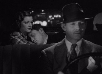 Movie still from “Test Pilot” (1938), directed by Victor Fleming – A man and a woman sleeping in the back of a car; Medium shot, High angle