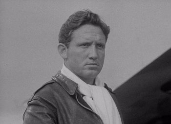 Movie still from “Test Pilot” (1938), directed by Victor Fleming – An old photo of a man wearing a leather jacket; Close Up shot, Low angle