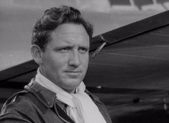 Movie still from “Test Pilot” (1938), directed by Victor Fleming – An old black and white photo of a man in a leather jacket; Close Up shot, Low angle