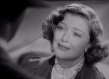 Movie still from “Test Pilot” (1938), directed by Victor Fleming – An old photo of a woman looking at the camera; Close Up shot, High angle