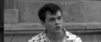 Movie still from “Tetro” (2009), directed by Francis Ford Coppola – Black and white photograph of a young man in a polka dot shirt; Close Up shot, High angle
