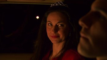 Movie still from “Tetro” (2009), directed by Francis Ford Coppola – A woman wearing a tiara in a dark room; Close Up shot, Over the shoulder angle