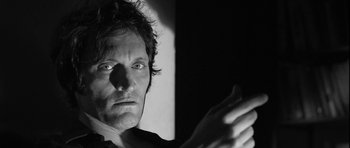 Movie still from “Tetro” (2009), directed by Francis Ford Coppola – Black and white photograph of a man with his hands raised; Close Up shot, Low angle