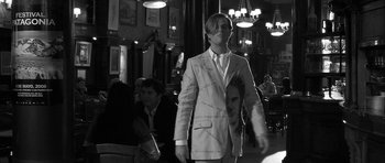 Movie still from “Tetro” (2009), directed by Francis Ford Coppola – A man in a suit and tie standing next to another man in a suit and tie; Medium shot, Low angle