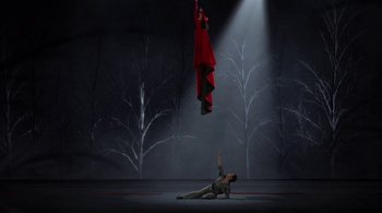 Movie still from “Tetro” (2009), directed by Francis Ford Coppola – A man is on the ground in a dark room; Wide shot, Low angle