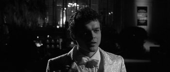 Movie still from “Tetro” (2009), directed by Francis Ford Coppola – A man in a suit and bow tie; Close Up shot, Low angle