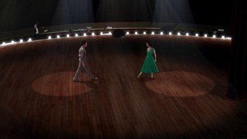 Movie still from “Tetro” (2009), directed by Francis Ford Coppola – A couple of people that are dancing on a stage; Extreme Wide shot, High angle