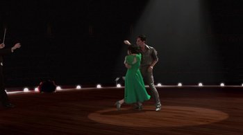 Movie still from “Tetro” (2009), directed by Francis Ford Coppola – A man and a woman are dancing on a stage; Wide shot, High angle