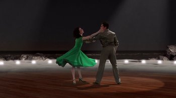 Movie still from “Tetro” (2009), directed by Francis Ford Coppola – A man and a woman dancing on a wooden floor; Wide shot, Low angle