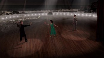 Movie still from “Tetro” (2009), directed by Francis Ford Coppola – A group of people standing on top of a wooden floor; Extreme Wide shot, High angle