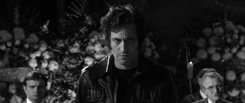 Movie still from “Tetro” (2009), directed by Francis Ford Coppola – Black and white photograph of a man in a leather jacket; Close Up shot, High angle