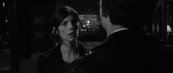 Movie still from “Tetro” (2009), directed by Francis Ford Coppola – A man and a woman are talking in a dark room; Close Up shot, Over the shoulder angle