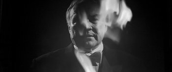 Movie still from “Tetro” (2009), directed by Francis Ford Coppola – A black and white photo of a man in a suit and bow tie; Close Up shot, Low angle