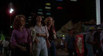 Movie still from “Tex” (1982), directed by Tim Hunter – A group of people standing next to each other on the street; Wide shot, Low angle