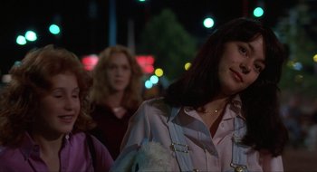 Movie still from “Tex” (1982), directed by Tim Hunter – Three women are walking down the street at night; Close Up shot, Over the shoulder angle