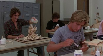 Movie still from “Tex” (1982), directed by Tim Hunter – A group of young men sitting at a table; Medium shot, Low angle