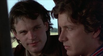Movie still from “Tex” (1982), directed by Tim Hunter – Two young men looking at one another in a car; Close Up shot, Over the shoulder angle