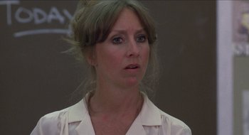 Movie still from “Tex” (1982), directed by Tim Hunter – A person wearing a white shirt; Close Up shot, Over the shoulder angle