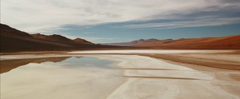 Movie still from “The 33” (2015), directed by Patricia Riggen – A body of water that is in the middle of a desert; Extreme Wide shot, High angle