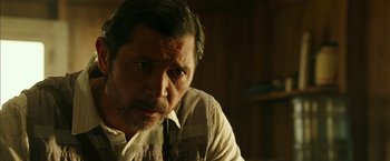 Movie still from “The 33” (2015), directed by Patricia Riggen – A person wearing a vest; Close Up shot, Over the shoulder angle