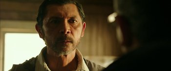 Movie still from “The 33” (2015), directed by Patricia Riggen – A person wearing a shirt; Close Up shot, Over the shoulder angle