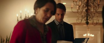 Movie still from “The 33” (2015), directed by Patricia Riggen – A man and a woman standing next to each other; Medium shot, Over the shoulder angle