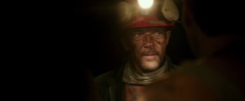 Movie still from “The 33” (2015), directed by Patricia Riggen – A person wearing a hat; Close Up shot, Low angle