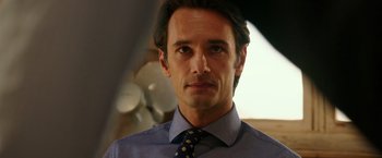 Movie still from “The 33” (2015), directed by Patricia Riggen – A person wearing a shirt and a tie; Close Up shot, Over the shoulder angle