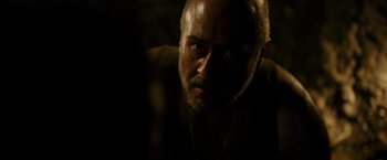 Movie still from “The 33” (2015), directed by Patricia Riggen – A person with a beard; Close Up shot, Over the shoulder angle